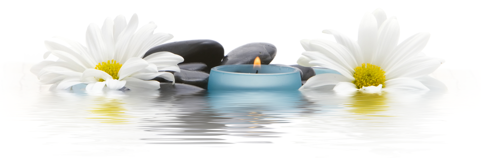 White daisies, black river stones, and a teal candle reflecting on still water